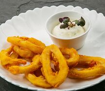 Кольца кальмара в фирменной панировке