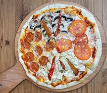 Четыре сезона, пицца на толстом тесте