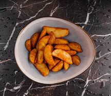 Картофельные дольки, жаренные во фритюре