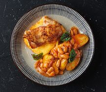 Жаркое по-гречески с куриным бедром, сыром фета в панировке, картофелем и фасолью