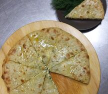 Пирог осетинский с сыром и зеленью большой