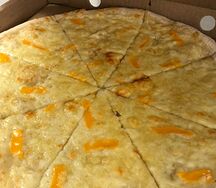 Пицца четыре сыра 