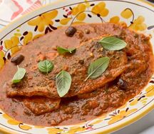 Сибас по-сицилийски с овощами в пряном соусе