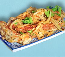 Свиные рёбра, жаренные с луком