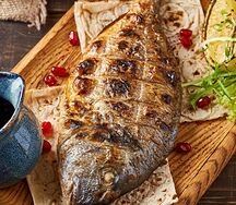 Дорадо на мангале в фирменном маринаде 