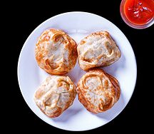 Манты, жаренные со свининой