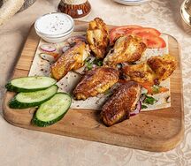 Крыло курицы, запеченное на мангале