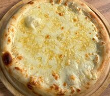 Пицца четыре сыра