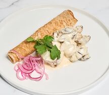 Свинина в сливочном соусе с шампиньонами