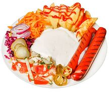 Хот-дог на тарелке