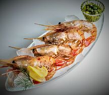 Креветки ботан, жаренные в чесночном соусе