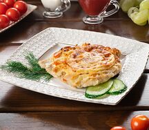 Отбивная из свинины с овощами и сыром