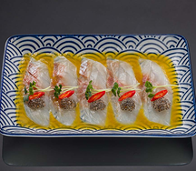 Тирадито из сибаса с соусом Севиче