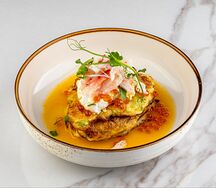 Драники из кабачка с крабом и яйцом пашот