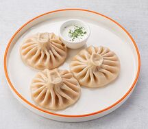 Хинкали с креветкой в соусе том-ям