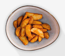 Картофельные дольки, жаренные во фритюре