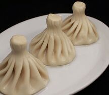 Хинкали, запеченные в сыре