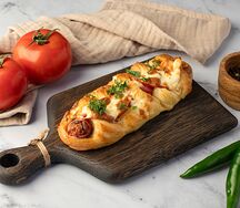 Сосиска в тесте с овощами