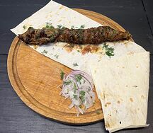 Шашлык из говяжьей печени в жировой сетке