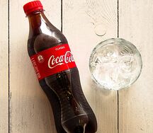 Вода газированная Coca- Cola пл/бут 0,5л