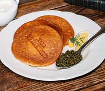 Икра осетра с пшенными блинами