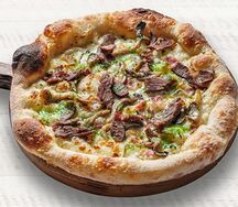 Пицца с щечками и вешенками