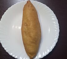 Пирожок с капустой жареный