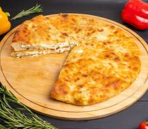 Осетинский пирог с сыром и зеленым луком