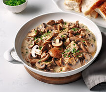 Porc sauté au champignons accompagné au pain