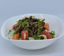 Salade de gésiers tiède et son œuf poché