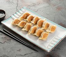 Пельмени жареные со свининой
