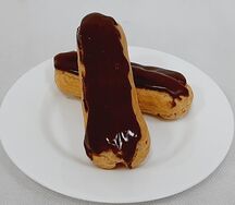 Пирожное Эклер с масляным кремом