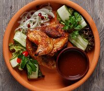 Цыпленок тапака с молодым картофелем