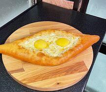 Хачапури по-аджарски с двумя яйцами
