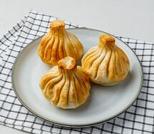 Хинкали с креветками и форелью жареные