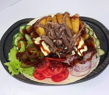 Шаверма на тарелке с копчёным мясом