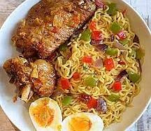 Spaghetti and fried egg or chicken 