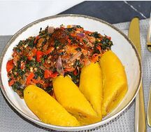 Boiled unripe plantain with veg and fish