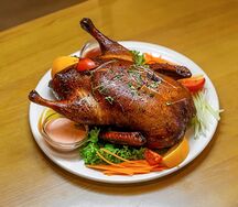 Утка, запечённая с с апельсинами, лимонами и сельдереем