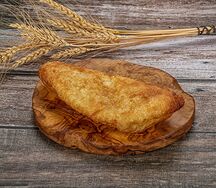 Пирожок с капустой жареный