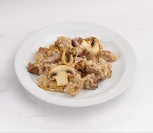 Свинина, тушенная с грибами в сливочном соусе