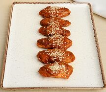 Крылья копченые в соусе том ям