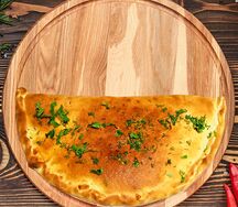 Пицца Кальцоне с ветчиной и грибами