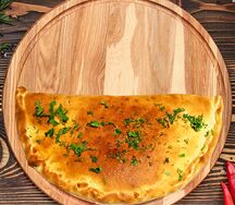 Пицца Кальцоне с ветчиной и грибами