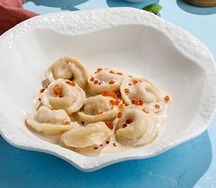 Пельмени с лососем, судаком и красной икрой