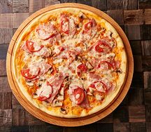 Пицца с ветчиной и грибами