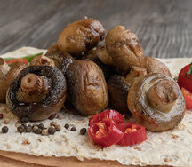 Шампиньоны на огне с маслом