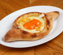 Хачапури по-аджарски с двойным яйцом