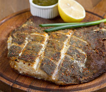 Жареная камбала с зеленым ткемали