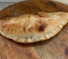 Пицца-кальцоне с ветчиной
